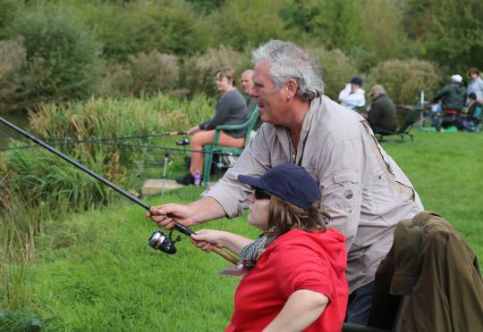 man and girl about to catch a fish