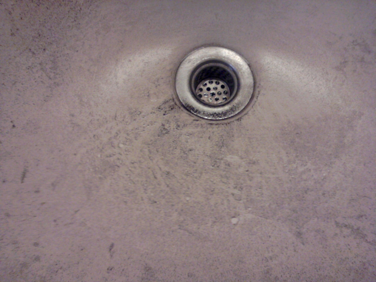 gritty residue coating a bathroom sink
