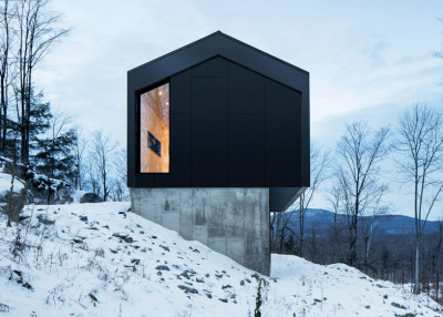 dezeen:<br /><br />A Quebec residence that is raised off a slope on a concrete podium »