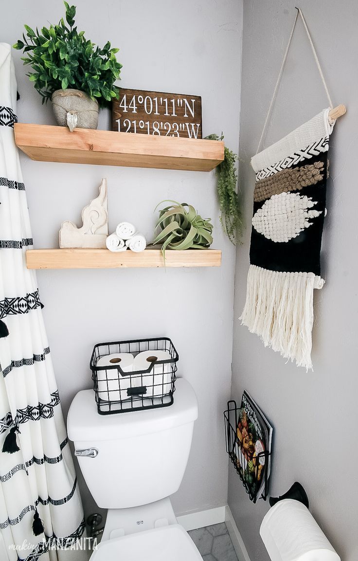 You’re going to love this bathroom decor on these floating shelves over toilet that have a fun boho style, but still fit in with the modern farmhouse theme! Perfect for some extra storage for towels and other things in a small bathroom. I love the wire basket on the back of the toilet to hold toilet paper. #boho #bathrooms #smallbathroom #bohostyle #bathroom You’re going to love this bathroom decor on these floating shelves over toilet that have a fun boho style, but still fit in with the modern farmhouse theme! Perfect for some extra storage for towels and other things in a small bathroom. I love the wire basket on the back of the toilet to hold toilet paper. #boho #bathrooms #smallbathroom #bohostyle #bathroom