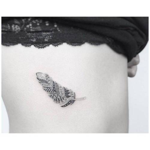 Fine line feather tattoo on the right side ribcage. Tattoo... small;jakubnowicz;grey;black;ornamental;rib;tiny;native american;feather;little;other;fine line