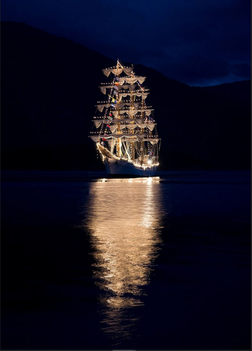 sixpenceee:A ship passing at night. 