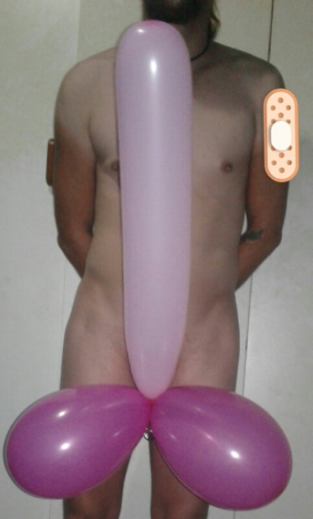 Having fun with some balloons tied to my cage…