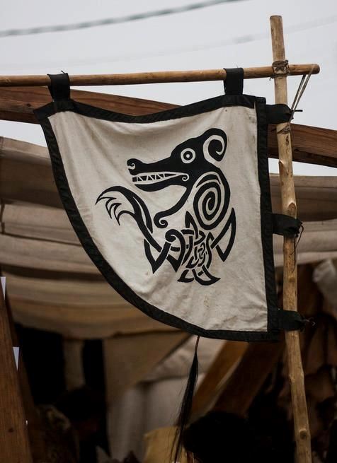viking flag with red and white stripes and a bird