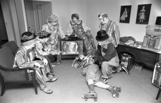 May 1973 - Clowns from the Shrine Circus watching the Watergate Hearings