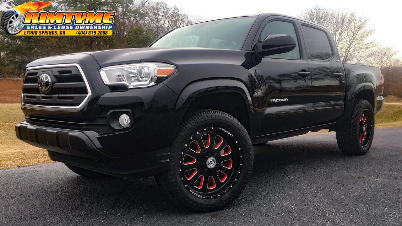 Toyota sitting on 20” XF Off-Road XFX-302 Black and Red Wheels wrapped in Kenda 285-55-20