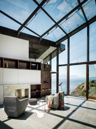 Glass-enclosed sitting area offers amazing views of the Pacific Ocean in this home located in Big Sur, California. [1680 × 2246]