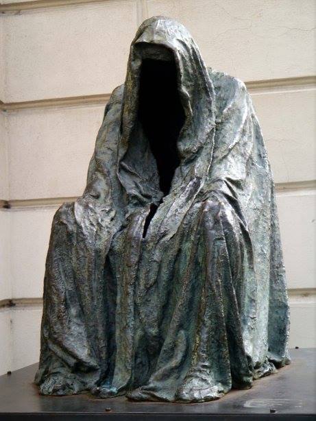 cloaked figure statue