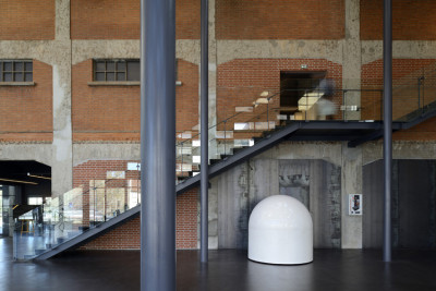 archatlas:<br /><br /><br /><br />Besançon Art Center and Cité de la Musique Kengo Kuma  Associates<br /><br />From the architect:Located in the eastern part of France, Besancon is also known as the city where Seiji Ozawa won the first prize at the International Competition of Orchestra Conductors (1959). Situated in the center of the city along the banks of the Doubs River, this multipurpose cultural facility is part of the FRAC project in France to stimulate cultural activity in regional areas, and features a music hall, contemporary art museum and conservatory (music school).The brick-clad warehouse that was built in the 1930s was converted into a museum. This structure, as well as the newly built music hall and conservatory are covered with a large green roof to tie them all together. Voids are provided between the respective boxes, and this space is covered by a green roof with a mosaic of plants and solar panels that allows soft light to come through.Images and text via <br /><br /> Kengo Kuma  Associates<br /><br />