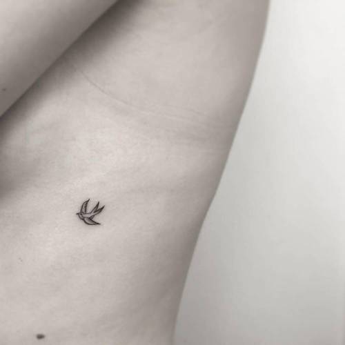 Tattoo tagged with: small, micro, nautical, animal, ok, swallow, rib, tiny,  bird, travel, little, minimalist 