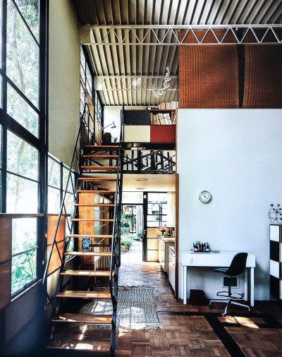 archatlas:<br /><br />Eames House Charles and Ray Eames<br /><br /><br /><br /><br />The Eames House, Case Study House #8, was one of roughly two dozen homes built as part of The Case Study House Program. Begun in the mid-1940s and continuing through the early 1960s, the program was spearheaded by John Entenza, the publisher of Arts and Architecture magazine.In a challenge to the architectural community, the magazine announced that it would be the client for a series of homes designed to express man’s life in the modern world. These homes were to be built and furnished using materials and techniques derived from the experiences of the Second World War. Each home would be for a real or hypothetical client taking into consideration their particular housing needs.<br />The first plan of the Eameses’ home, known as the Bridge House, was designed in 1945 by Charles Eames and Eero Saarinen. The design used pre-fabricated materials ordered from catalogues, a continuation of the idea of mass-production. Charles and Ray moved into the House on Christmas Eve, 1949, and lived there for the rest of their lives.  The interior, its objects and its collections remain very much the way they were in Charles and Ray’s lifetimes.  The house they created offered them a space where work, play, life, and nature co-existed. <br />Images via + via + via<br />