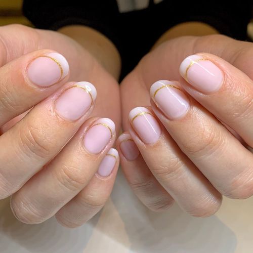 A clean and modern take on the classic French manicure featuring...