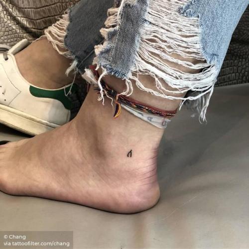 Minimalist wishbone tattoo on the wrist