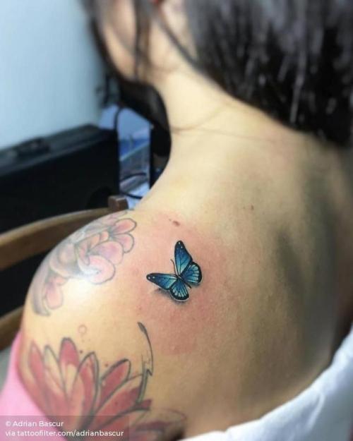 Butterfly tattoo on the shoulder blade