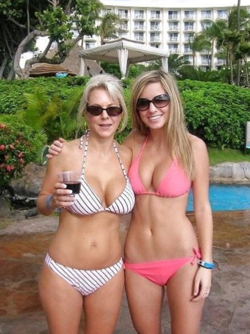 A vacationing mother and daughter that enjoy fun in the sun during the day