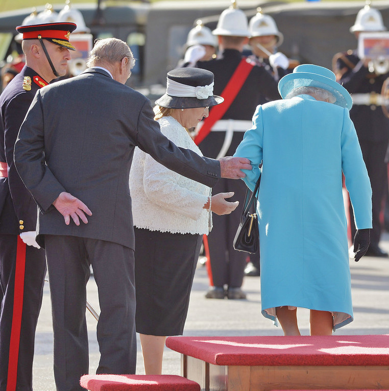 The British Royal Family — royalwatcher: Prince Philipp gallantly helps his...