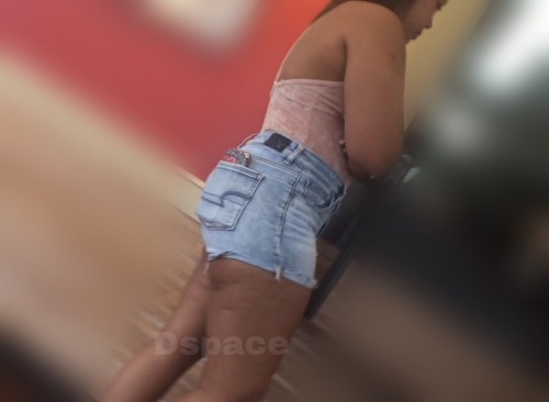 FAT ass Latina in shorts.