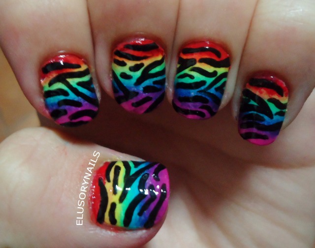 Zebra print on rainbow gradient nails.