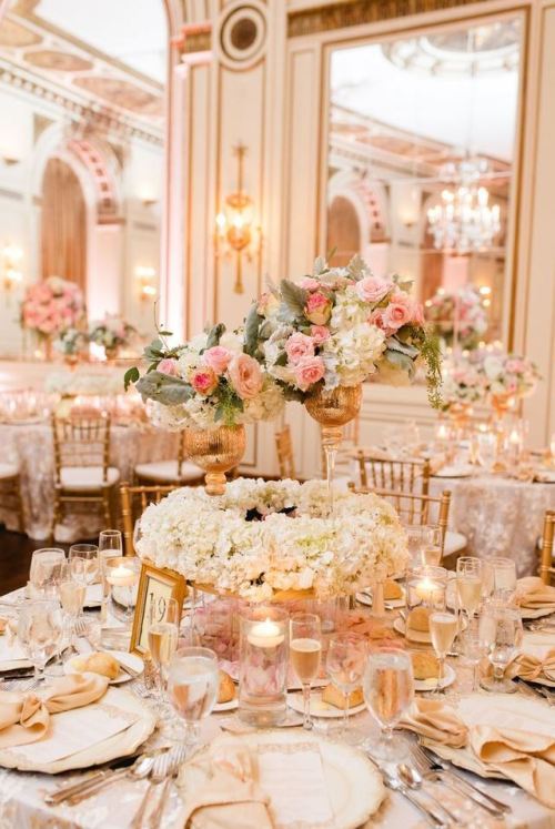 Love the table settings filled with gold, white and pink colors