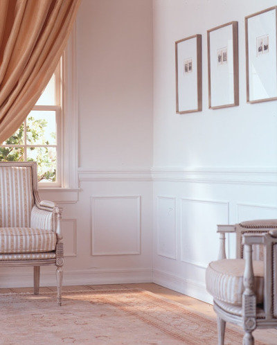 Wainscoting and panel molding are one of the easiest ways to add architectural detail and interest to a typical suburban beige box. No more boring orange peel walls now there can be a bit of class in a boring square box of a room. Love it!