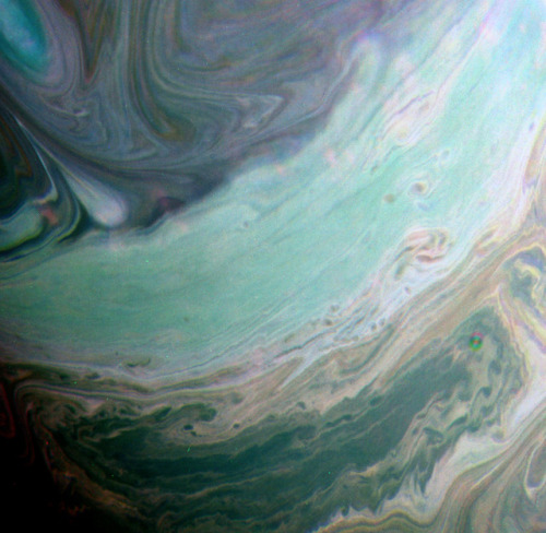 astronomyblog:Saturn’s atmosphere exhibits a banded pattern...