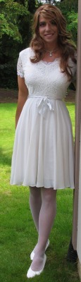 This informal  wedding  dress  is modeled by young The 