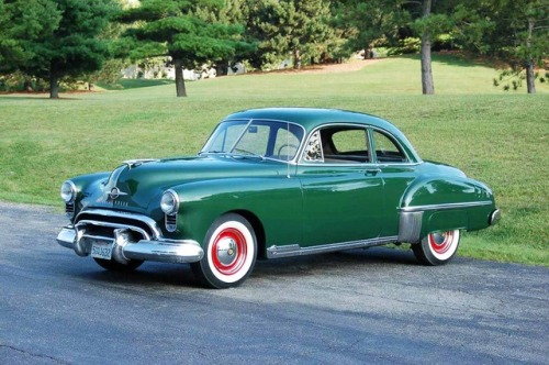 crownedstoat:The first muscle car, Oldsmobile Rocket 88.