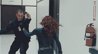 Black Widow (Scarlett Johansson) doing her signature leg chokehold takedown move in Iron Man 2