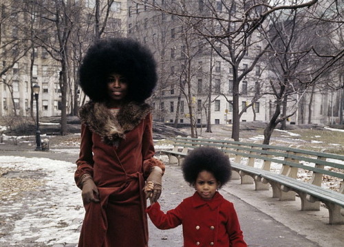 historium:70’s style. Mother and daughter taking a walk in New...