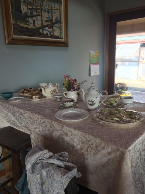 Picture of a table laid with china and some platters of food