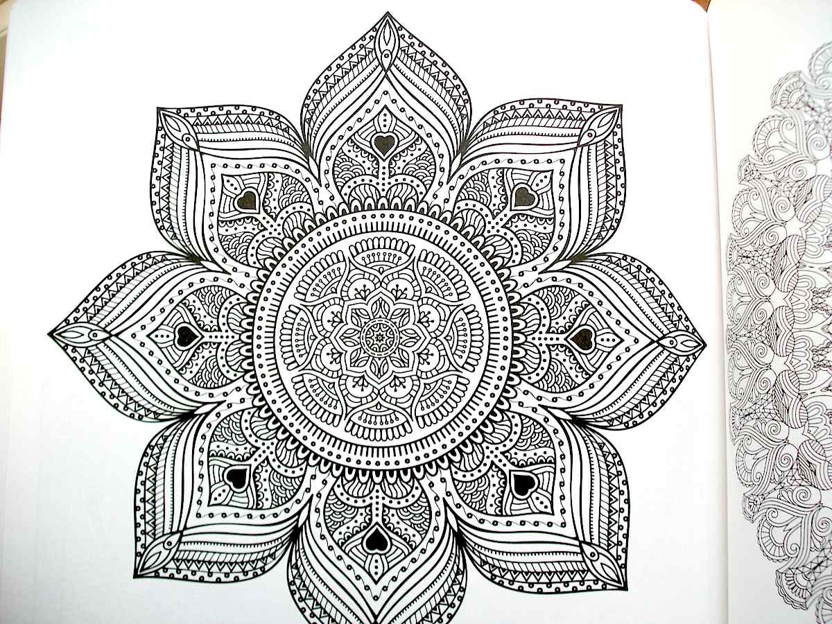 The Mandala Meditation Coloring book combines...