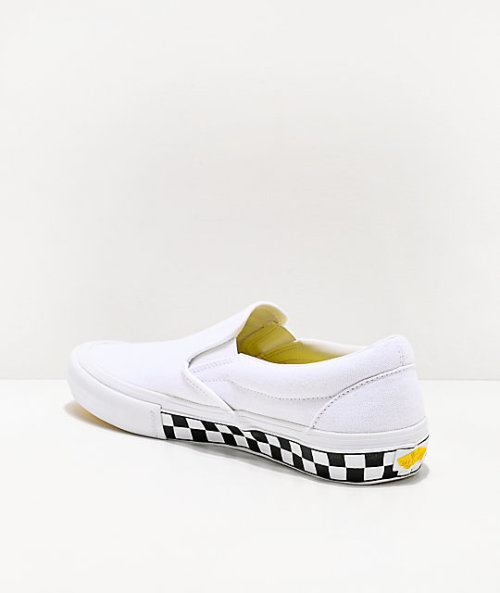 yellow and white checkerboard vans slip ons