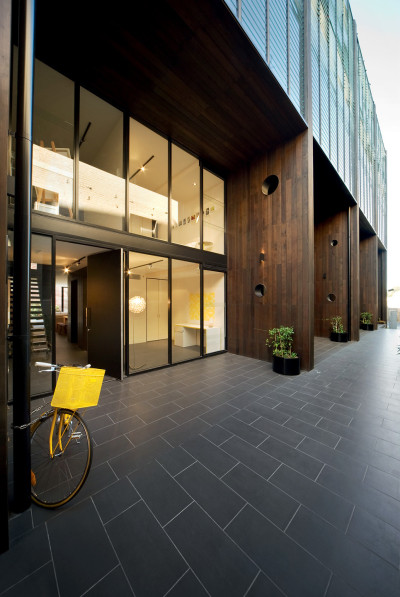 archatlas:<br /><br /><br /><br />Hue ApartmentsHue designed by <br /><br />Jackson Clements Burrows Architects<br /><br />is a 5 level 29 apartment residential development in inner city Richmond, Australia. The project is unusual and innovative providing both a two storey walk-in townhouse type at ground level and three stories of one and two bedroom apartments above. The sectional concept for the building limits the circulation areas to a minimum significantly improving the sellable floor area available to apartments. The facade provides an abstract presence at street level which diminishes the sense of scale of the building relative to the domestic scale of the houses on the opposite side of the street.Images and text via