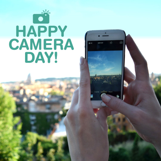 Taking a photo of a landscape with a smart phone, Happy Camera Day! 