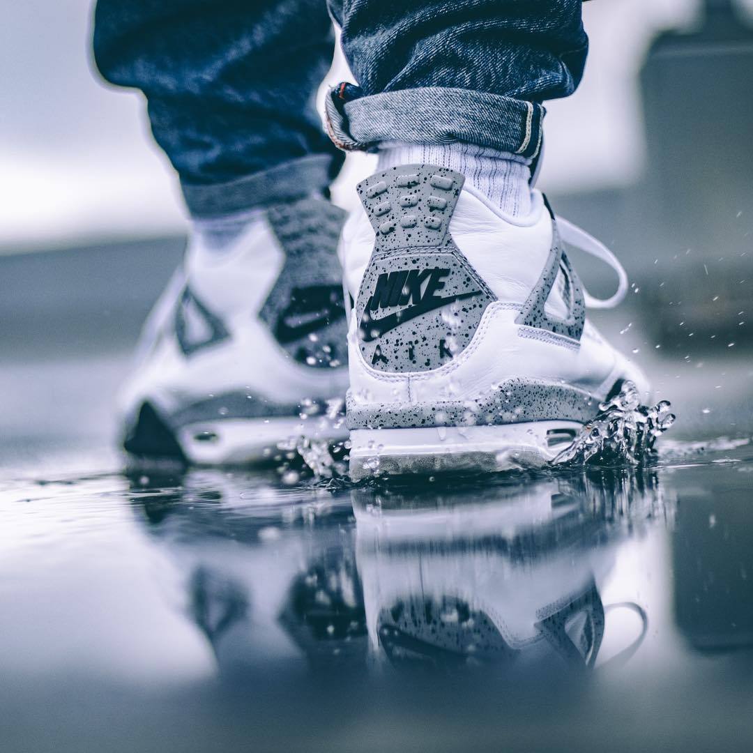jordan 4 white cement on feet