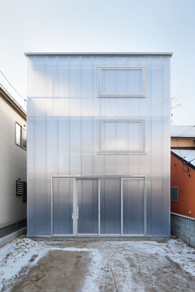 ombuarchitecture:<br /><br />House in Tousuien<br />Hiroshima • Japan<br />By Suppose Design Office<br />The House of Tousuien is located in a quiet residential area, and it is designed for a couple and 3 children. The three sides of this house are surrounded by other residence buildings, and the shape of the site forces the house to stay long and narrow.<br />Most exterior walls are thick and heavy, where windows are added to balance out the heavy look of the exterior. For the House of Tousuien, we used a thin and translucent material to replace the regular exterior walls, where natural light and be maximized in the interior space.<br />via Archdaily<br />