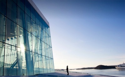 prettyarchitecture:<br /><br />New Norwegian Opera and Ballet, Oslo, Norway<br />This landmark building by Snøhetta, who also designed the new Library of Alexandria (2002), is the largest cultural center built in Norway in 700 years. Its sloping stone roof - made up of 36,000 fitted pieces – rises up from the fjord; allowing members of the public, residents and opera goers alike, to walk over the building, developing a relationship with the public structure. <br />Integral to the 1,000-room interior, which is largely lined with crafted woodwork (using the traditions of Norwegian boat builders), are a number of art commissions interwoven into the structural fabric, including a cloakroom, a collaboration with their 2007 Serpentine Pavilion collaborator Olafur Eliasson.<br />Photo’s: Bustler<br />