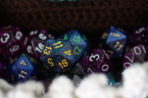 thatcrochetnerd:Mimic Dice BagI made a mimic dice bag to...