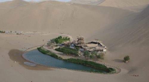 sixpenceee:
“ Crescent Lake, China
Yueyaquan is a crescent-shaped lake in an oasis, south of the city of Dunhuang in Gansu Province, China. The depth of the lake, a popular tourist spot, had decreased over the years as sand encroached on the site but...