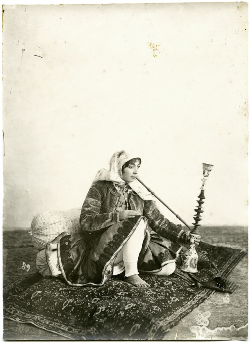 tanyushenka:Portrait of a woman smoking a waterpipe.Iran,...