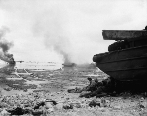 waffenss1972:US Marines take refuge from enemy fire on the...