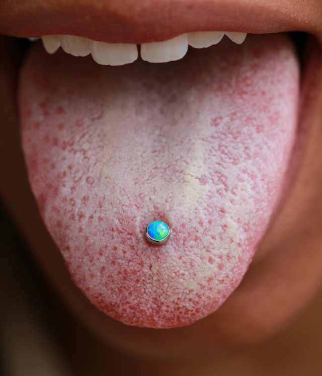 - Tongue piercings are apparently making quite the...