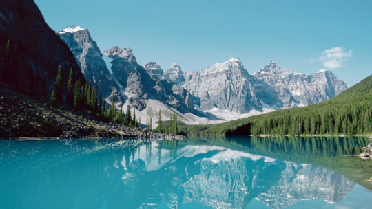 Canada clear lake with snow covered mountain