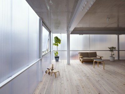 ombuarchitecture:<br /><br />House in Tousuien<br />Hiroshima • Japan<br />By Suppose Design Office<br />The House of Tousuien is located in a quiet residential area, and it is designed for a couple and 3 children. The three sides of this house are surrounded by other residence buildings, and the shape of the site forces the house to stay long and narrow.<br />Most exterior walls are thick and heavy, where windows are added to balance out the heavy look of the exterior. For the House of Tousuien, we used a thin and translucent material to replace the regular exterior walls, where natural light and be maximized in the interior space.<br />via Archdaily<br />