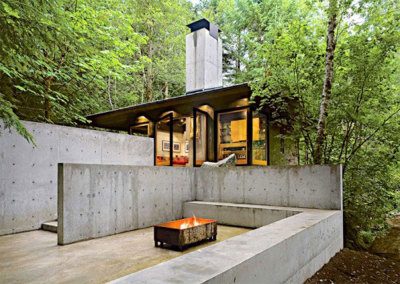 archatlas:<br /><br /><br /><br />Tye River Cabin Olson KundigSituated in a dense forest near the Tye River, this meditative retreat connects to the nature that surrounds it.The square base of the two-level structure is rendered in cast-in-place concrete, as is the large central fireplace that serves as the core and anchor for the cabin. Custom-designed, pivoting glass windows swing open to reveal the corners and sides of the space, blurring the line between inside and outside. Rusted mild steel siding wraps the exterior areas not given over to windows. Deep overhangs shelter the main living area from the regular rain showers. Concrete patios extend the living space outdoors and follow the contours of the land toward the water.Images and text via<br /><br /> Olson Kundig<br /><br />