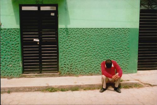 sad in red: the quiet of the street matched the stillness of...