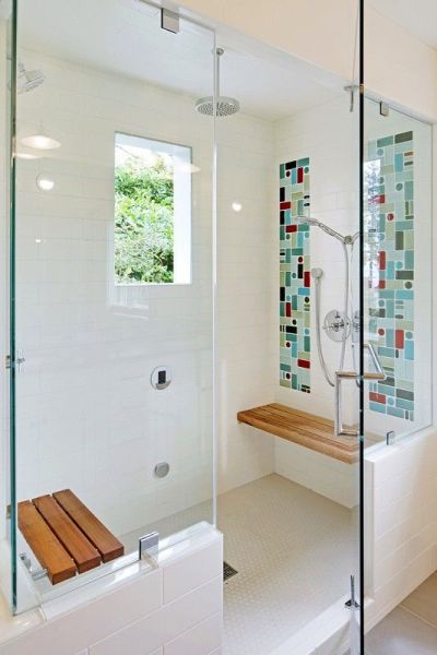 I like the walk in shower and the benches. Not so much the tiles itself. Would change to something more muted.