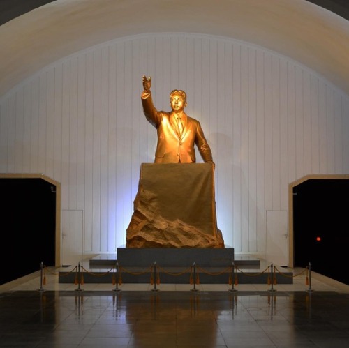 A statue depicting Kim Il Sung giving his address marking the...