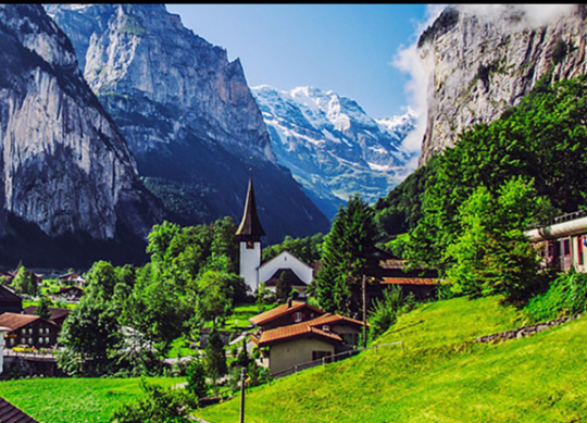 Switzerland green grass between mountain 