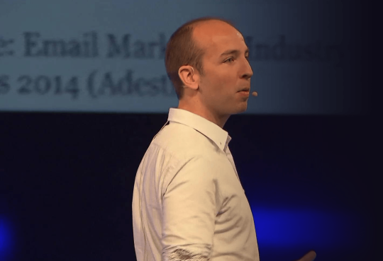 Brian speaking at a conference Brian speaking at a conference